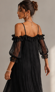 Vestido negro de muselina con hombros descubiertos y bordes de encaje